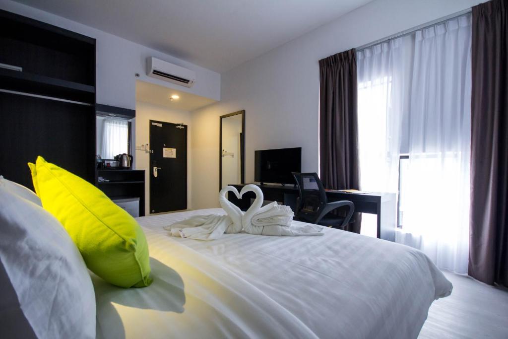 Postel nebo postele na pokoji v ubytování Manhattan Hotel Ipoh
