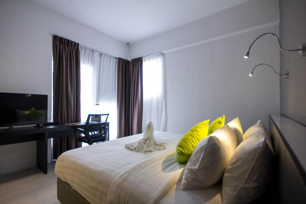 Postel nebo postele na pokoji v ubytování Manhattan Hotel Ipoh