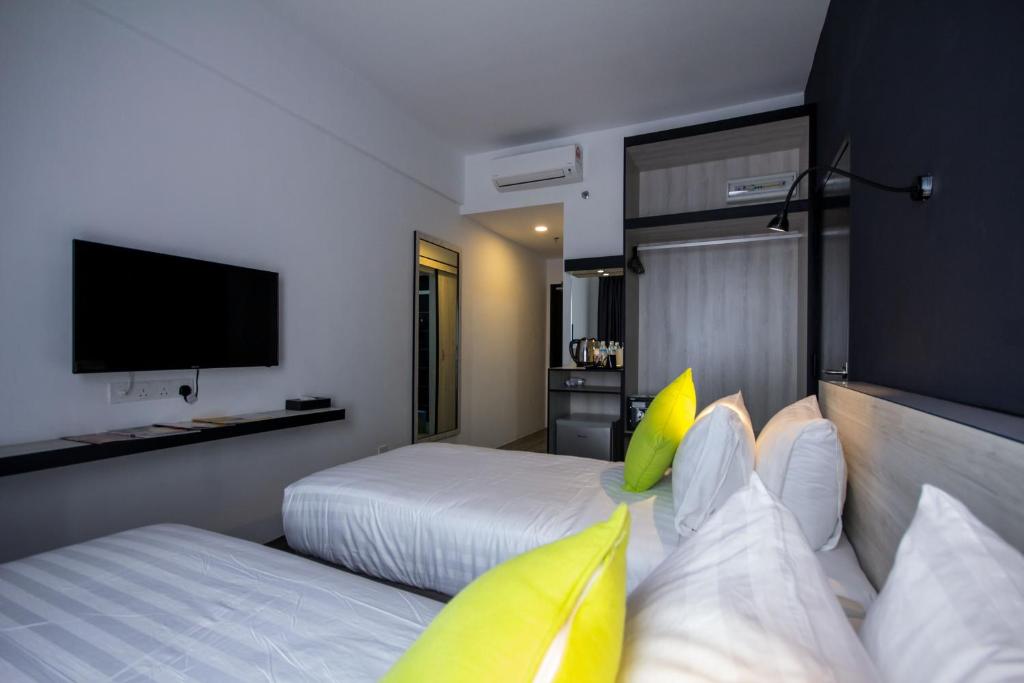 Postel nebo postele na pokoji v ubytování Manhattan Hotel Ipoh