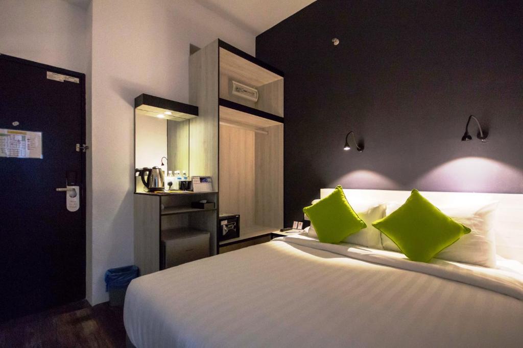Postel nebo postele na pokoji v ubytování Manhattan Hotel Ipoh