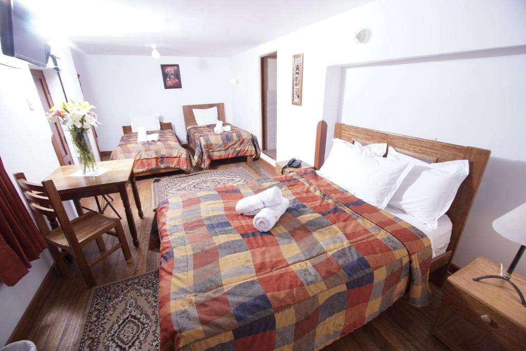 Postel nebo postele na pokoji v ubytování Casa Union Cusco