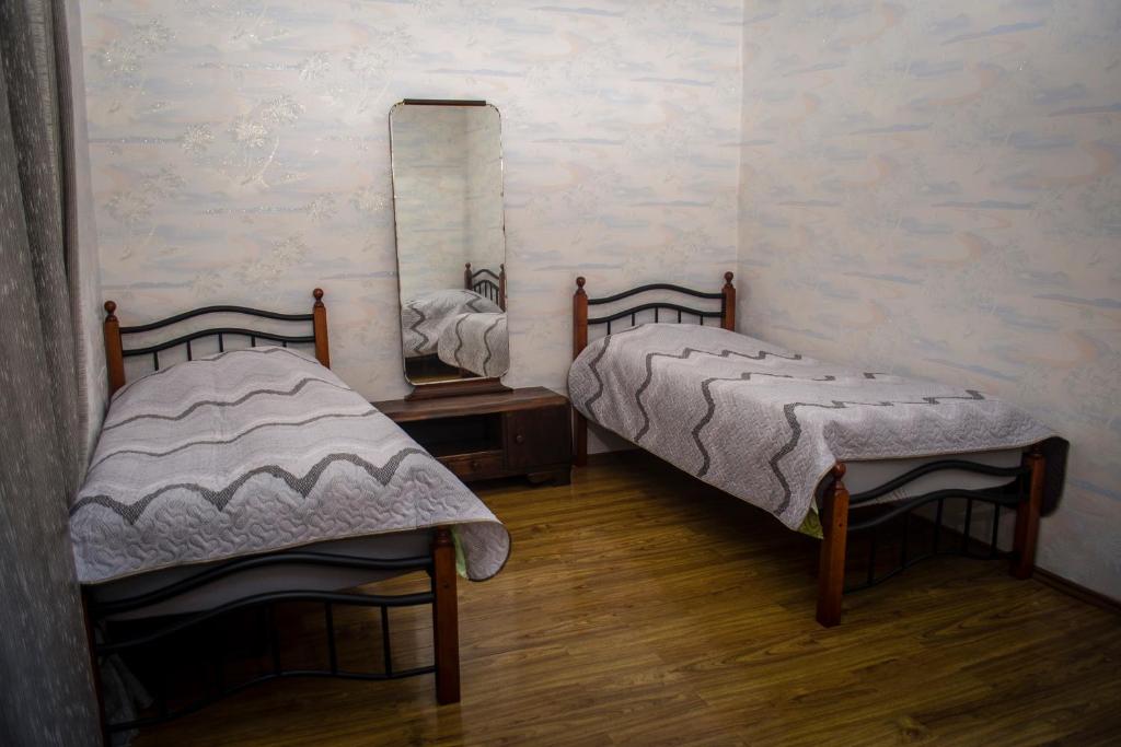 Postel nebo postele na pokoji v ubytování GNG Guest House