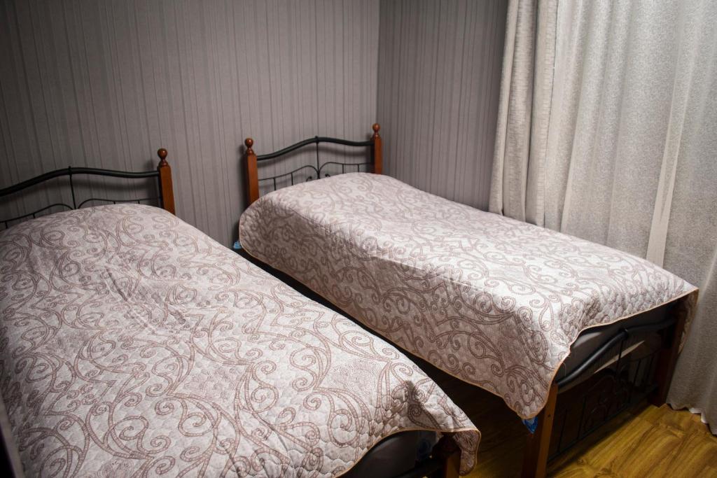 Postel nebo postele na pokoji v ubytování GNG Guest House