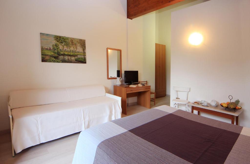 Postel nebo postele na pokoji v ubytování Hotel Colomber