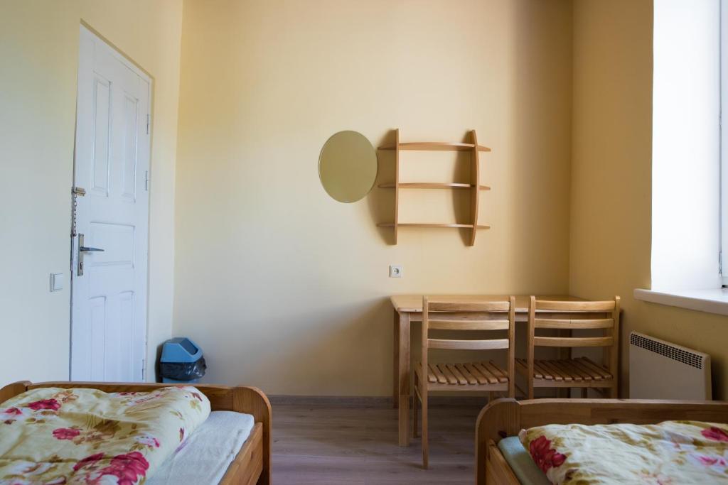 Postel nebo postele na pokoji v ubytování Fortuna Hostel