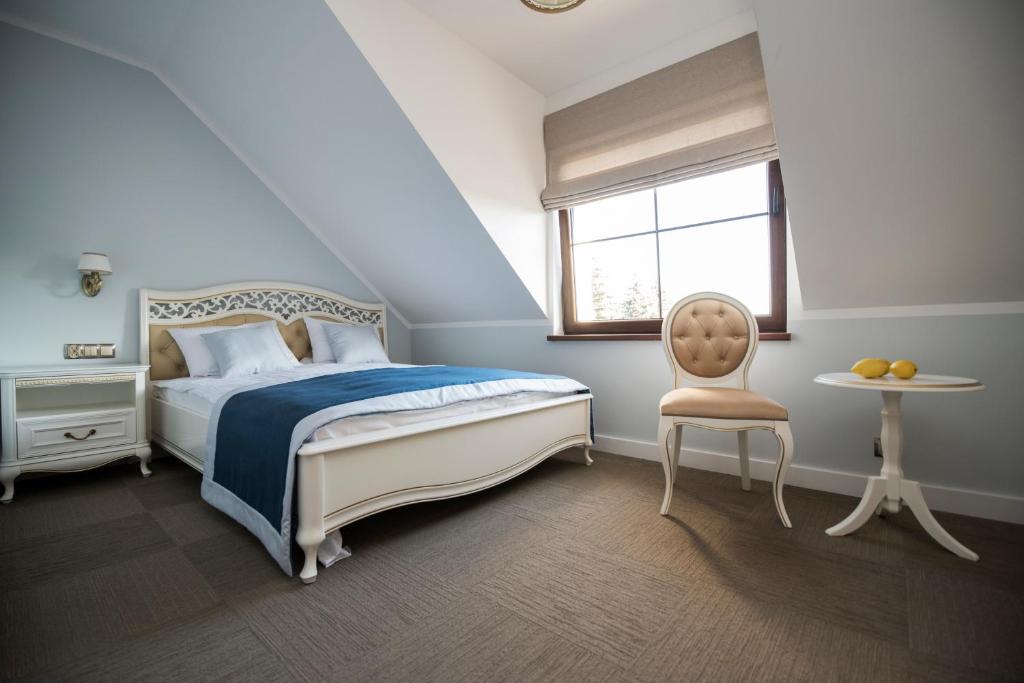 Postel nebo postele na pokoji v ubytování Apartamenty Giżycko