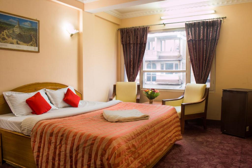 Voodi või voodid majutusasutuse Hotel Kamal toas
