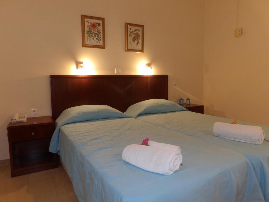 Postel nebo postele na pokoji v ubytování Dassia Beach Hotel