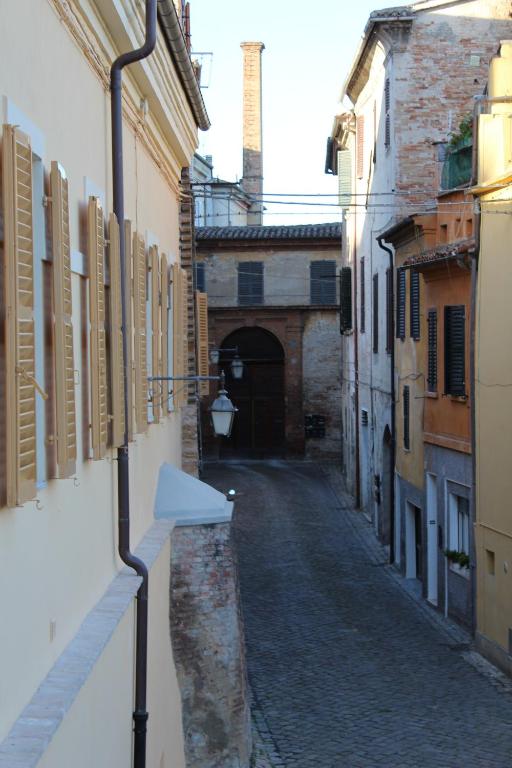 an alley in an old town with a building at B&B Da Zia Ore in Iesi
