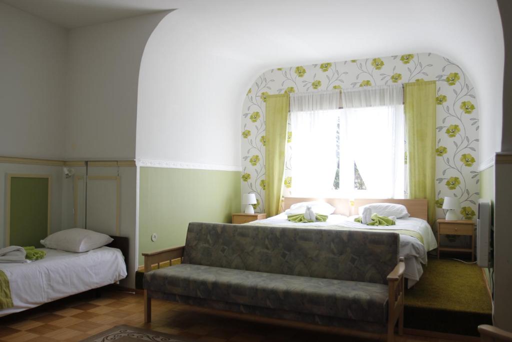 Postel nebo postele na pokoji v ubytování Villa Marleen