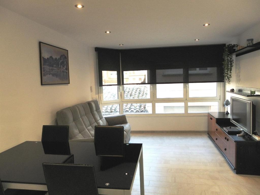 A seating area at Apartament Margarit