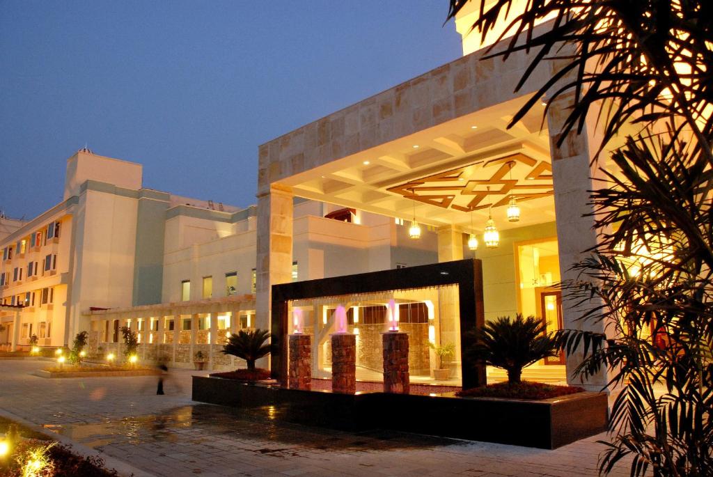 a large building with a lot of lights at Cambay Grand Kukas in Jaipur