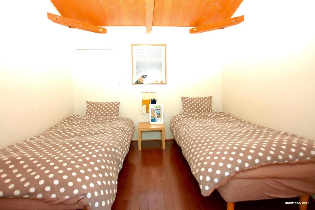 Postel nebo postele na pokoji v ubytování PavilionSurf&Lodge