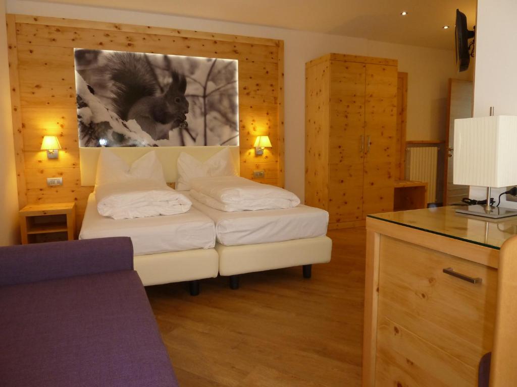 Postel nebo postele na pokoji v ubytování Hotel Pineta