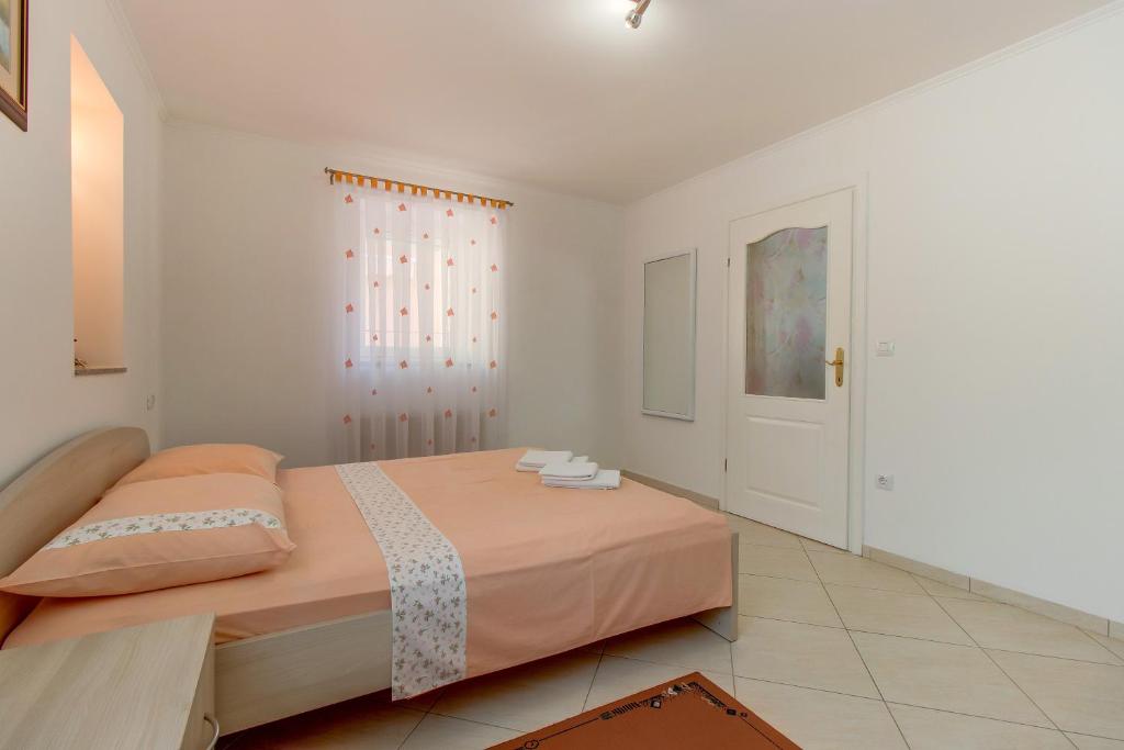 Posteľ alebo postele v izbe v ubytovaní Apartments Leila