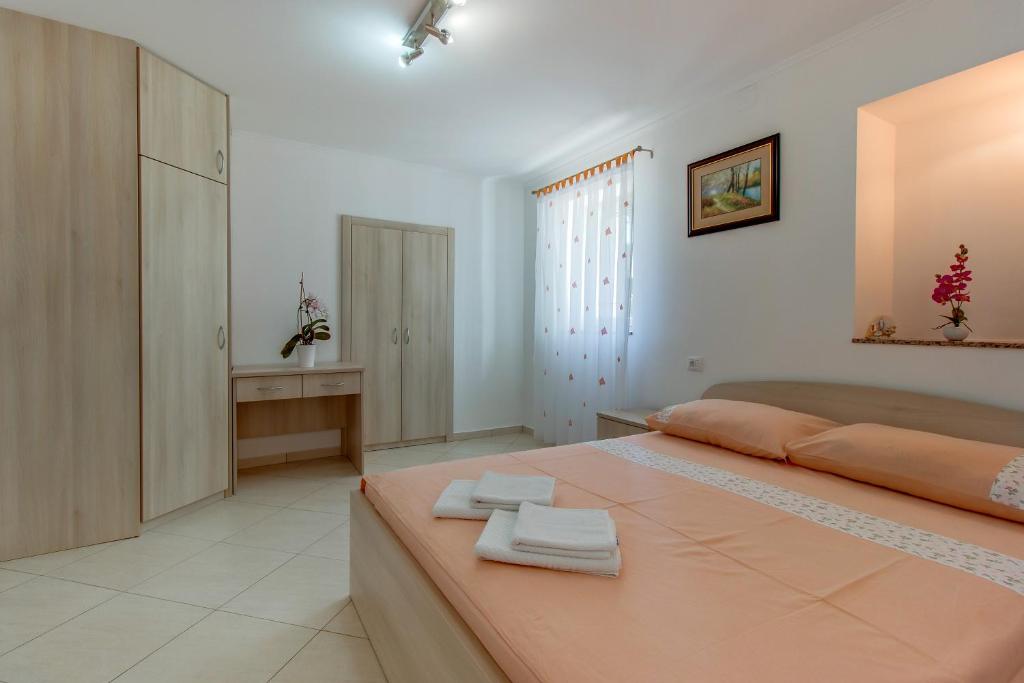 Posteľ alebo postele v izbe v ubytovaní Apartments Leila