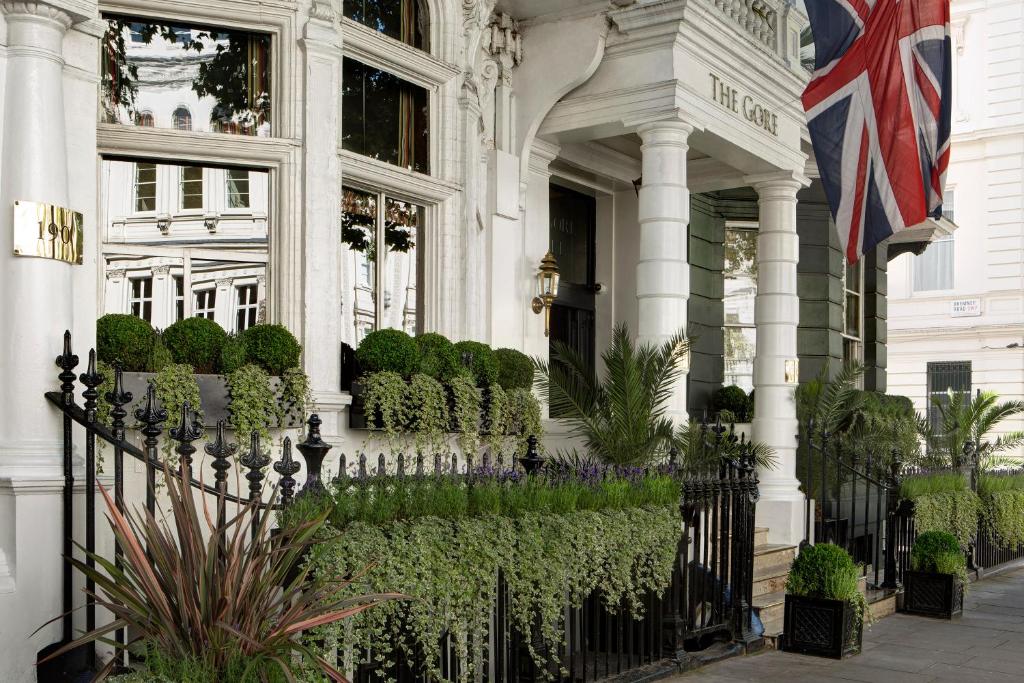a large white building with a flag on the front of it at The Gore London - Starhotels Collezione in London