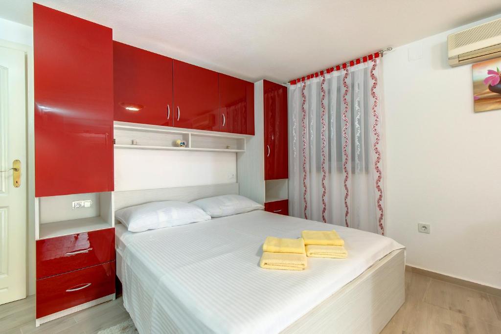 Posteľ alebo postele v izbe v ubytovaní Apartments Leila