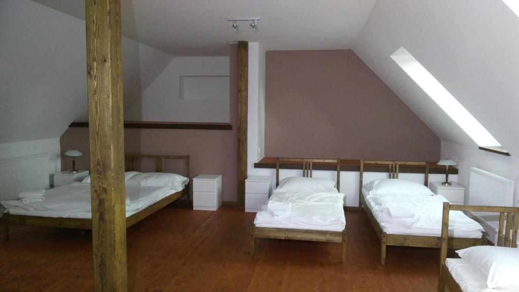 Postel nebo postele na pokoji v ubytování Hotel U Zeleneho stromu