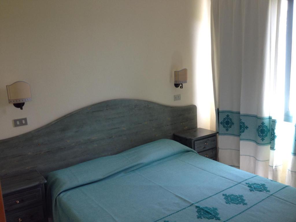 Postel nebo postele na pokoji v ubytování Residence Marina Palace