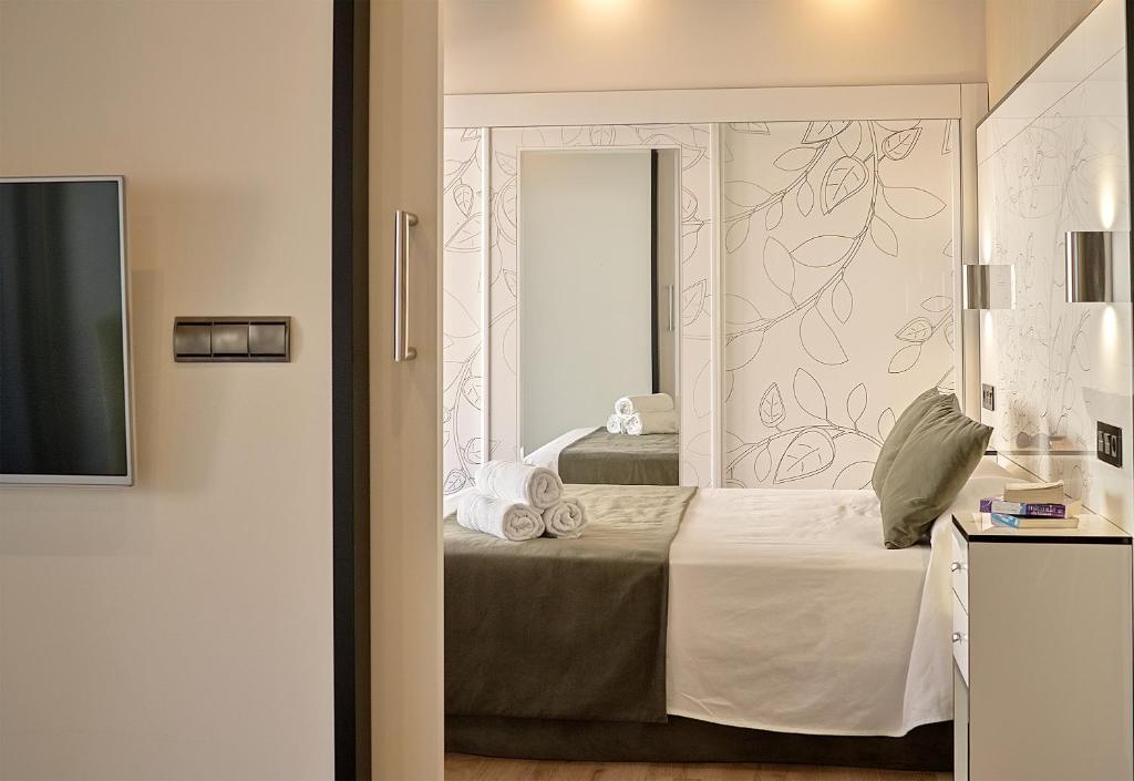 Posteľ alebo postele v izbe v ubytovaní Apartamentos Suites Oficentro Deluxe
