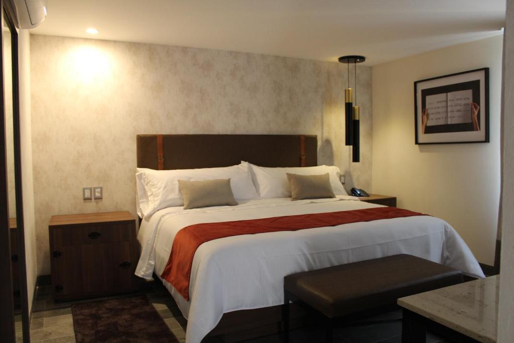 Postel nebo postele na pokoji v ubytování Hotel Ronda Minerva