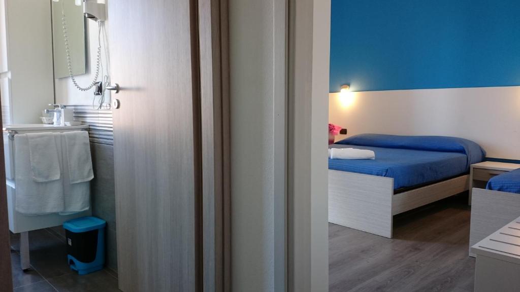 Posteľ alebo postele v izbe v ubytovaní Hotel Ogliastra