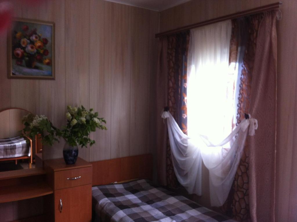 Postel nebo postele na pokoji v ubytování Mini Hotel Уютный дворик