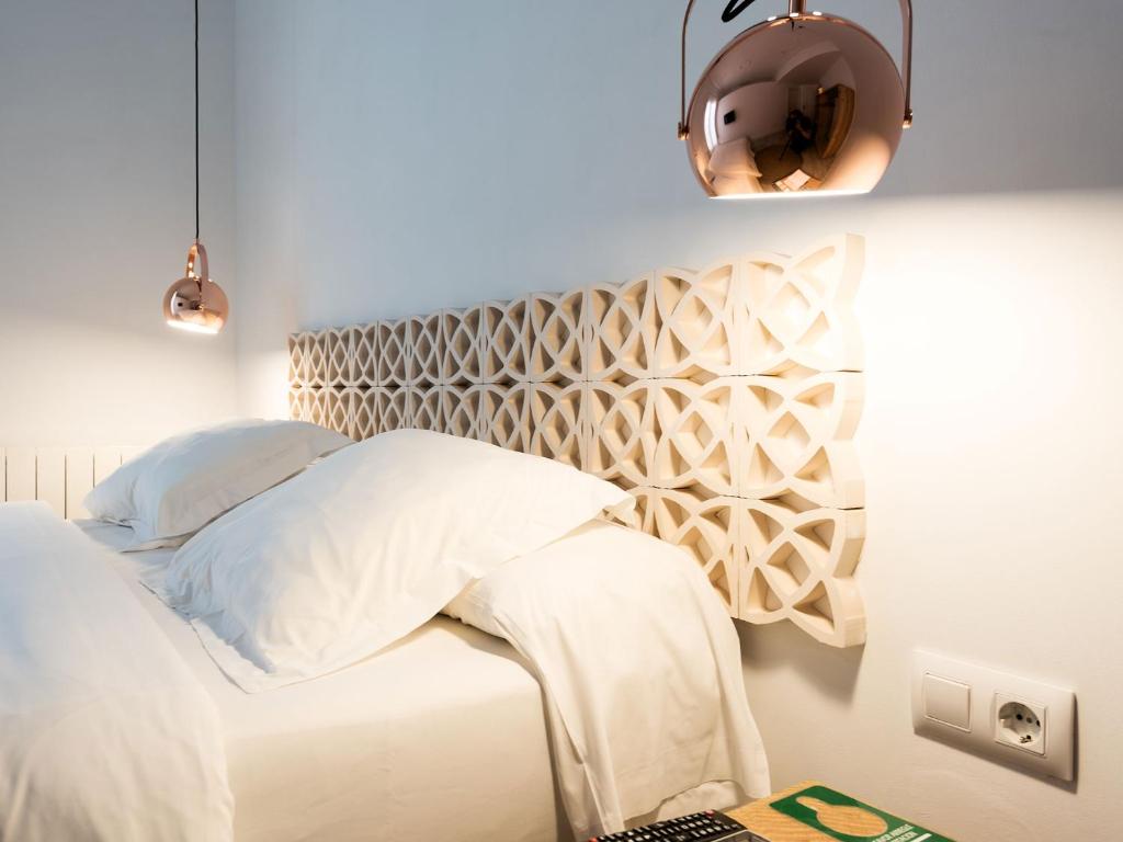 A bed or beds in a room at Bruc & Bruc