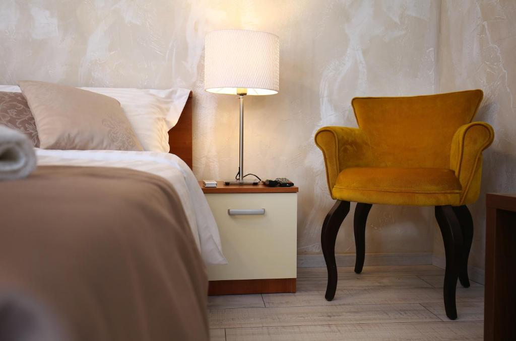 Postel nebo postele na pokoji v ubytování Luxury Lidija Rooms