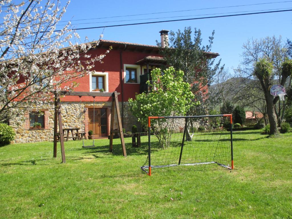 a yard with a goal in front of a house at Casa Rural El Jondrigu in Cangas de Onís