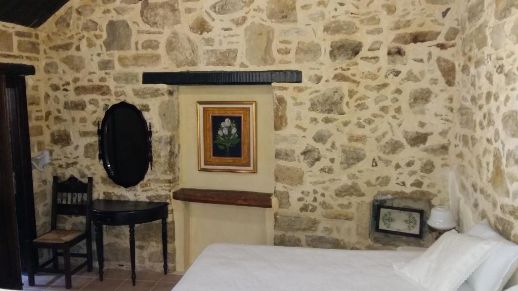 Postel nebo postele na pokoji v ubytování Kritikies