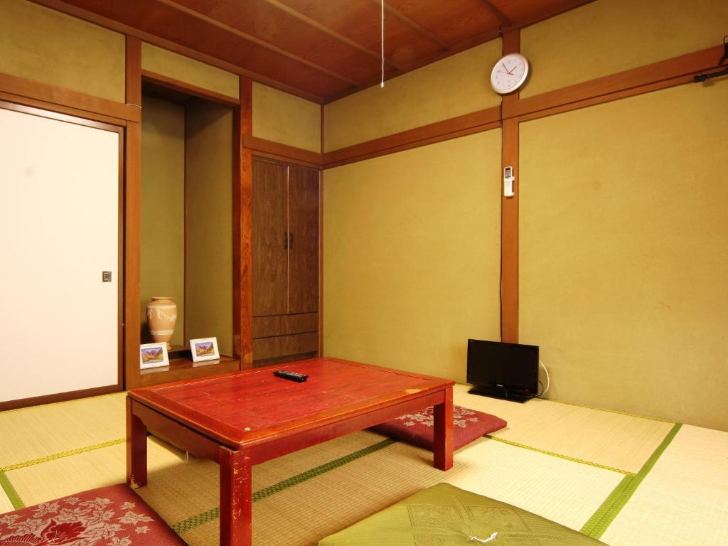 TV a/nebo společenská místnost v ubytování Guesthouse Tomoshibi