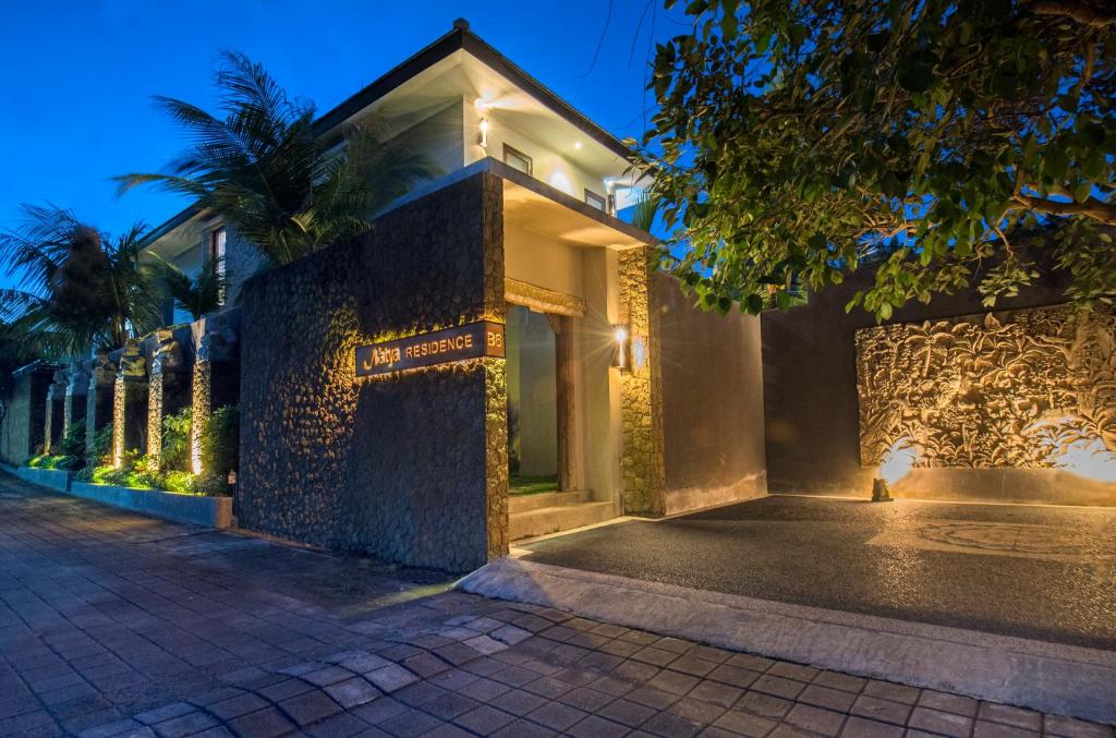 a building with lights on it at night at Natya Residence Jimbaran in Jimbaran