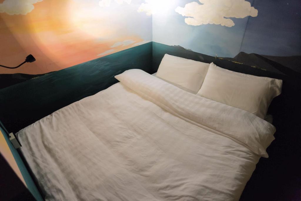 Postel nebo postele na pokoji v ubytování Angels Hostel Taipei Ximen
