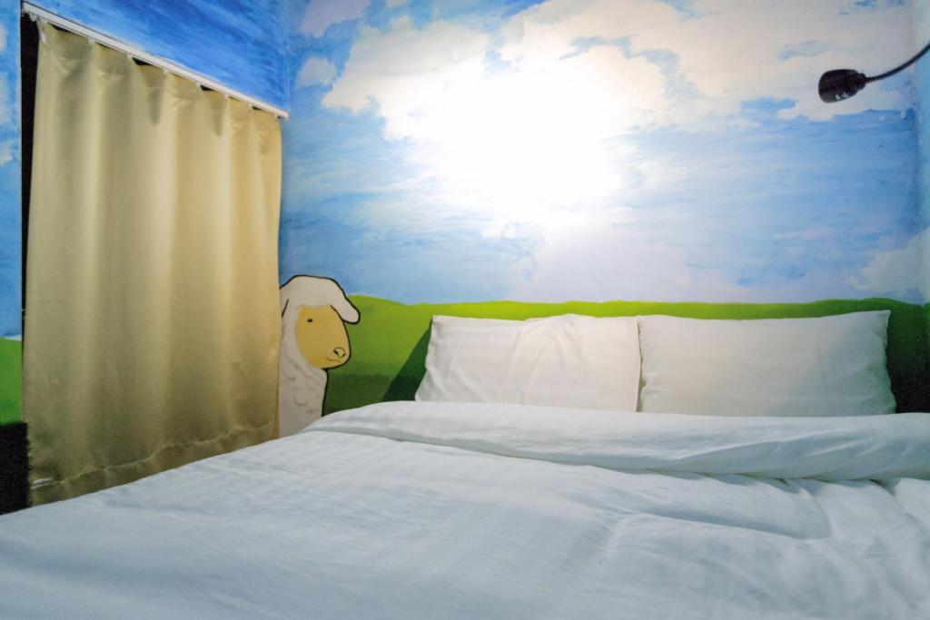 Postel nebo postele na pokoji v ubytování Angels Hostel Taipei Ximen