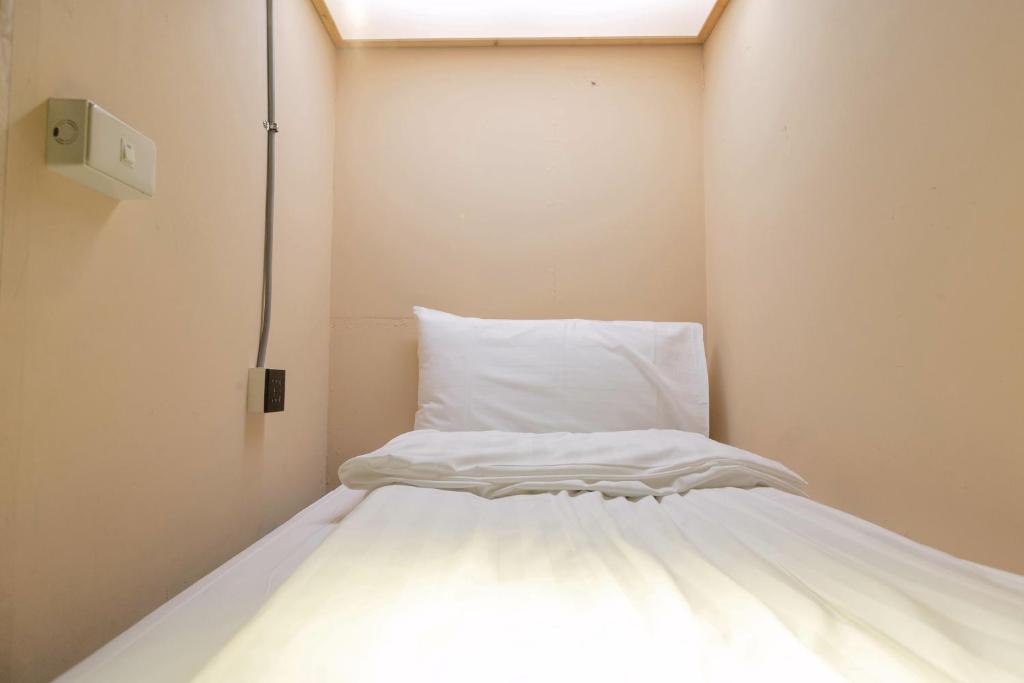 Postel nebo postele na pokoji v ubytování Angels Hostel Taipei Ximen