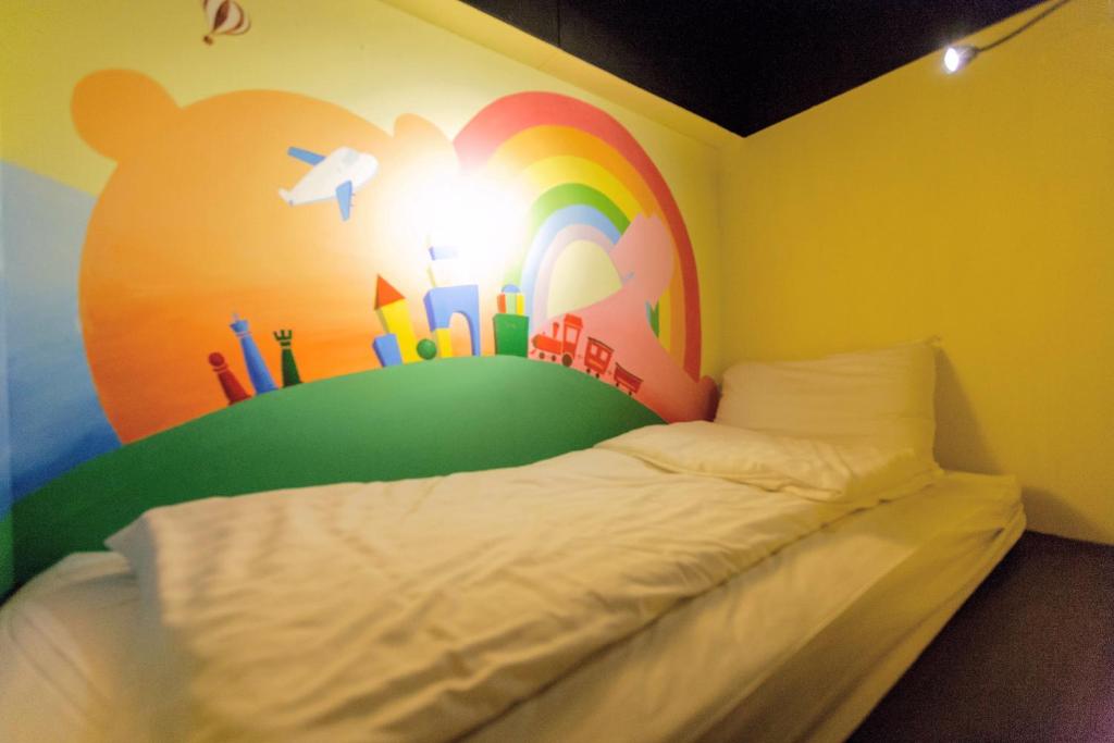 Postel nebo postele na pokoji v ubytování Angels Hostel Taipei Ximen