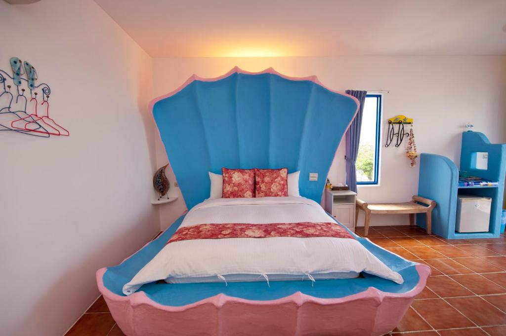 Postel nebo postele na pokoji v ubytování Haisu Homestay