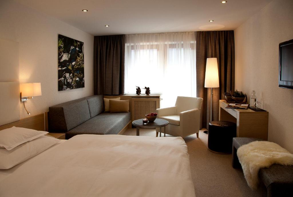 Postel nebo postele na pokoji v ubytování Hotel Rössle Superior