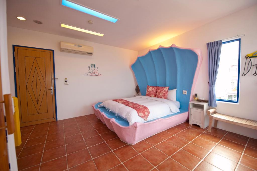 Postel nebo postele na pokoji v ubytování Haisu Homestay