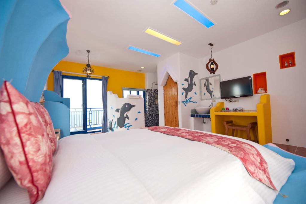Postel nebo postele na pokoji v ubytování Haisu Homestay