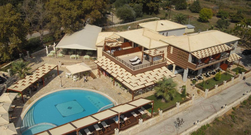 an aerial view of a house with a swimming pool at Riviera Perdika Hotel in Perdika
