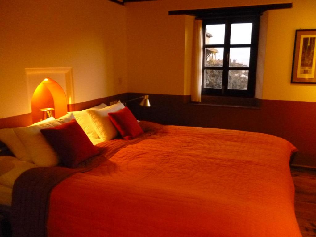 Postel nebo postele na pokoji v ubytování Milla Guesthouse Bhaktapur