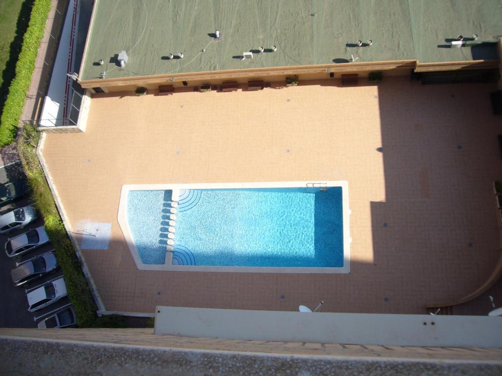 an overhead view of a swimming pool on the side of a building at Finlandia - Fincas Arena in Benidorm