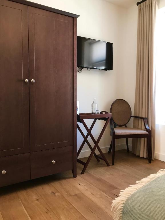 TV a/nebo společenská místnost v ubytování Boutique-Hotel Garni Bellevue Davos Wiesen