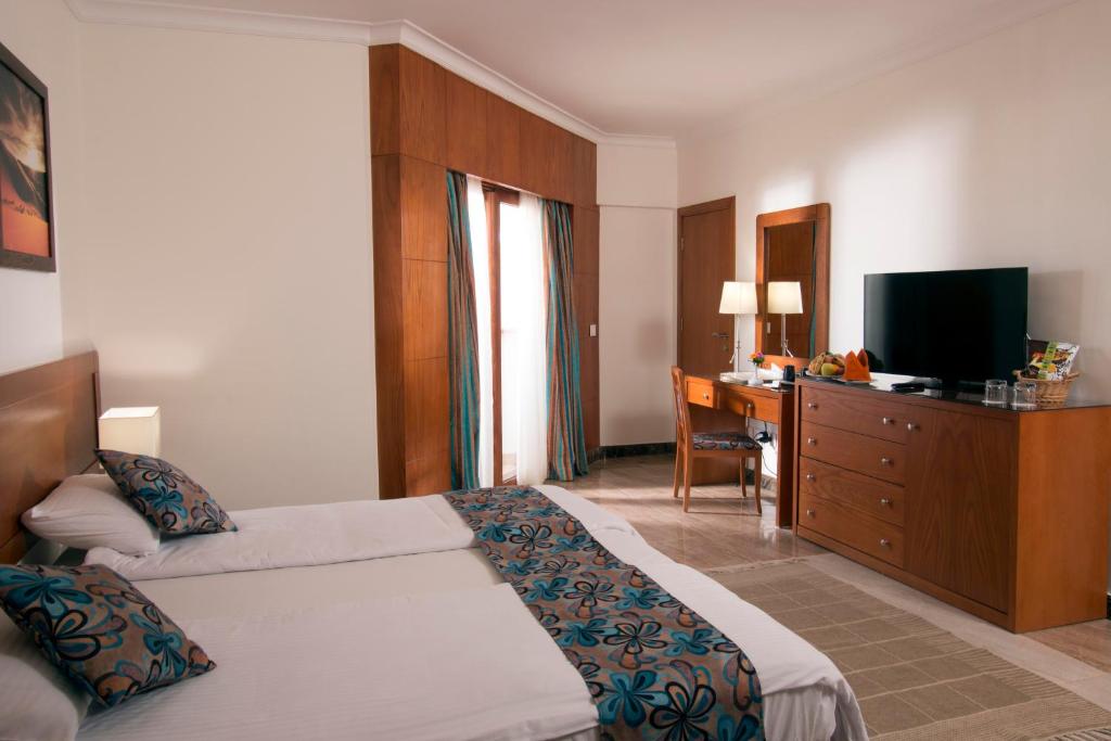 Postel nebo postele na pokoji v ubytování Swiss Inn Resort Dahab