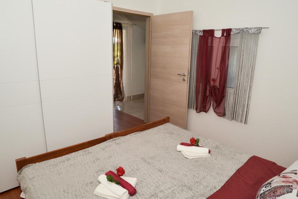 Postel nebo postele na pokoji v ubytování Apartment Antonio