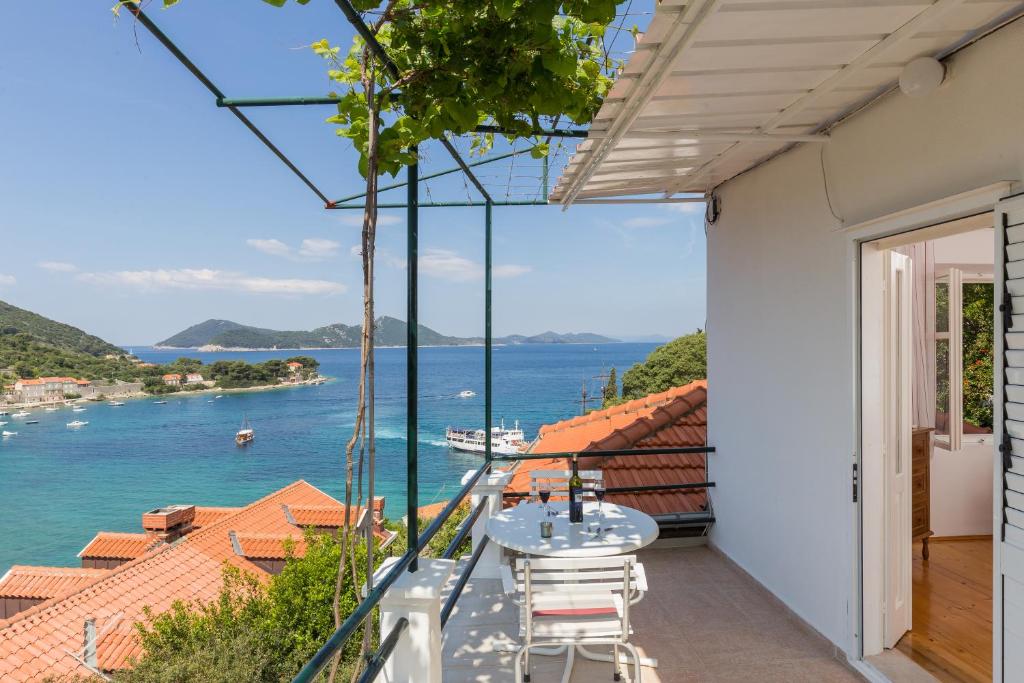 a balcony with a view of the water at Apartments Miskovic in Koločep