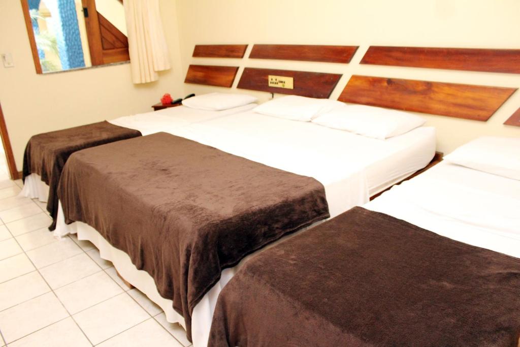 Postel nebo postele na pokoji v ubytování Coroa Bella Praia Hotel